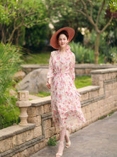 A lady wears a pink dress.